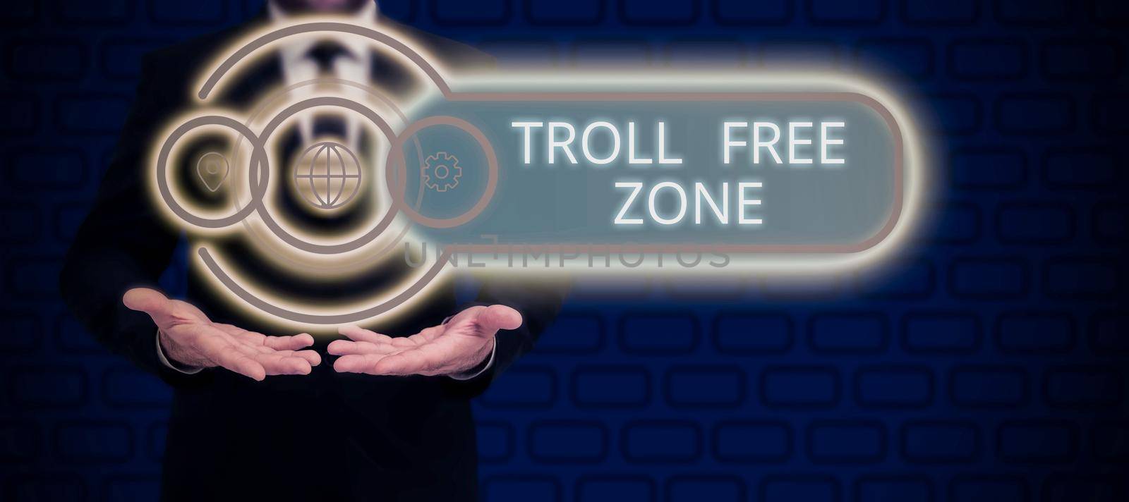 Inspiration showing sign Troll Free Zone. Word for Social network where tolerance and good behavior is a policy Man Pointing On Glowing Digital S And Receiving Crucial Information. by nialowwa