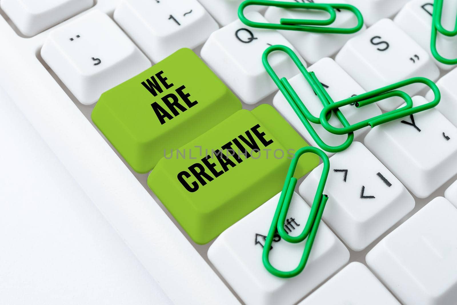 Text caption presenting We Are Creative, Business approach To have a lot of creativity original ideas good for design Businessman Holding Mobile Phone And Speech Bubble Popping Out With Ideas.