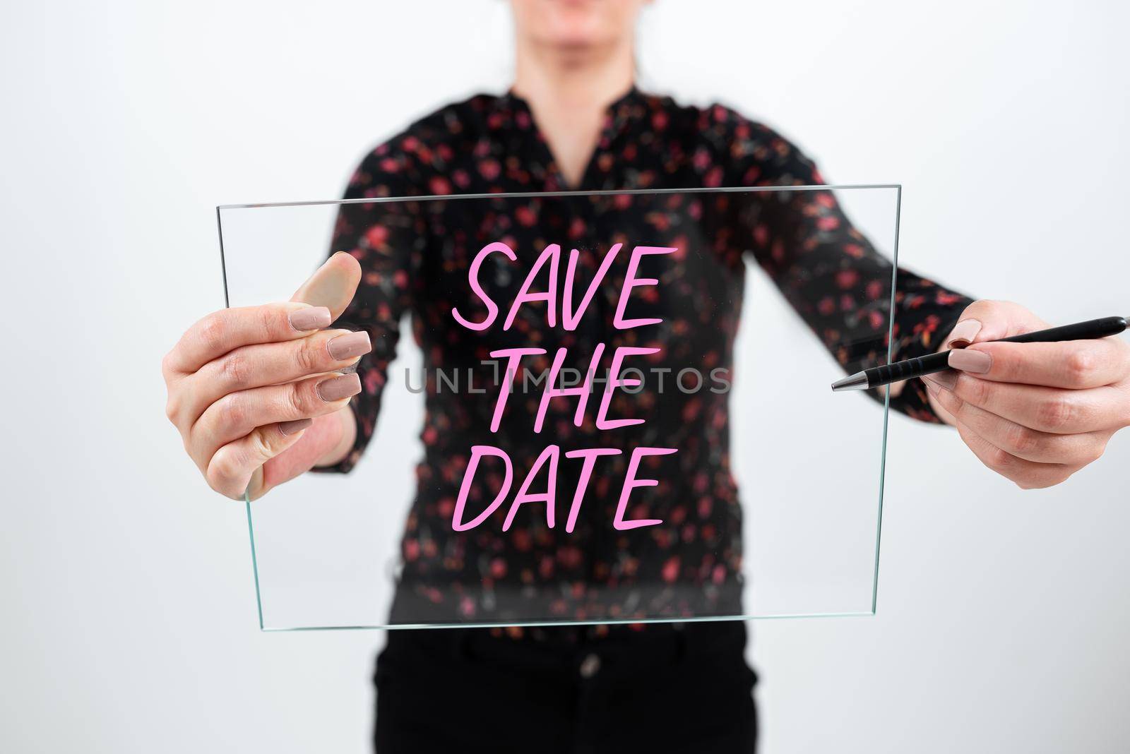 Text caption presenting Save The Date. Concept meaning Systematized events Scheduled activity Recorded Filed Important Messages Presented On Mobile Phone On Desk With Paperwraps. by nialowwa