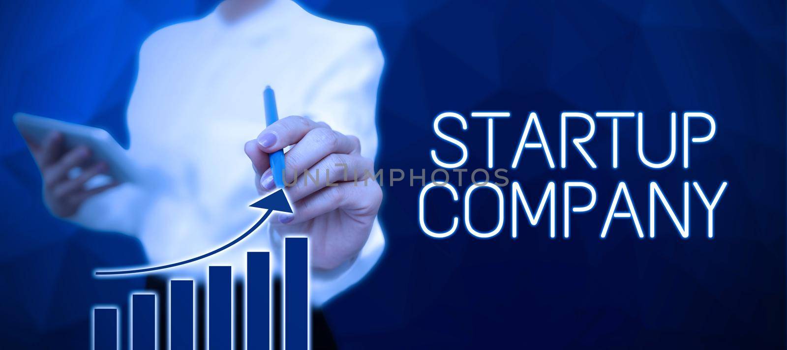 Text sign showing Startup Company, Word for Newly emerged business created by new entrepreneurs Woman Holding Note With Important News And Pointing On It With Pen.