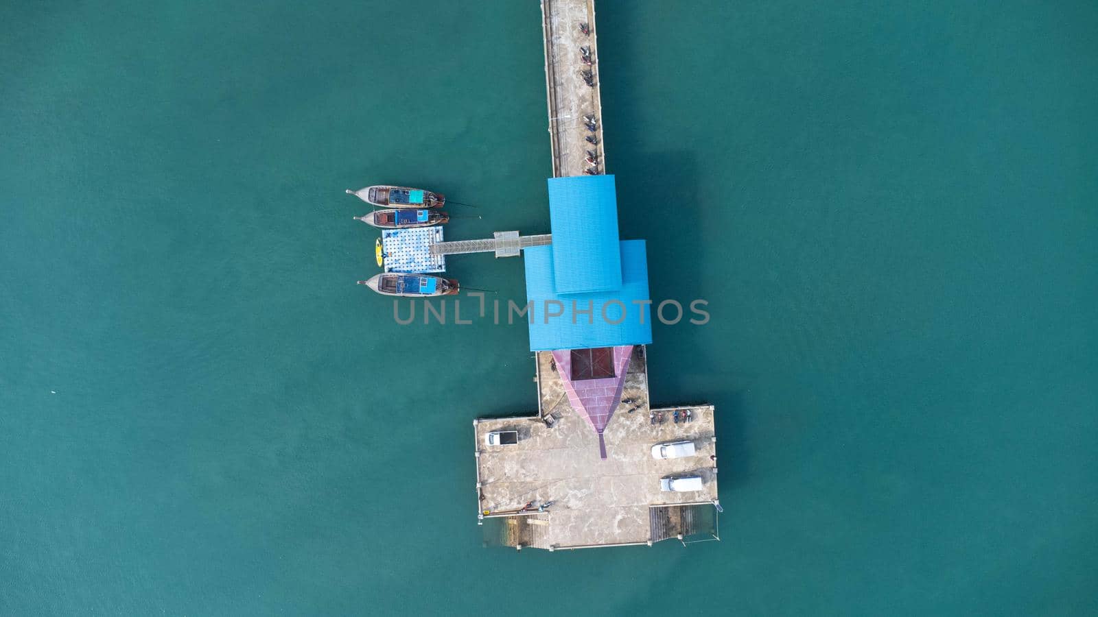 Aerial view from drone of Yacht and cruise ship parked in the marina. Transportation and travel background, beautiful sea in summer. by TEERASAK