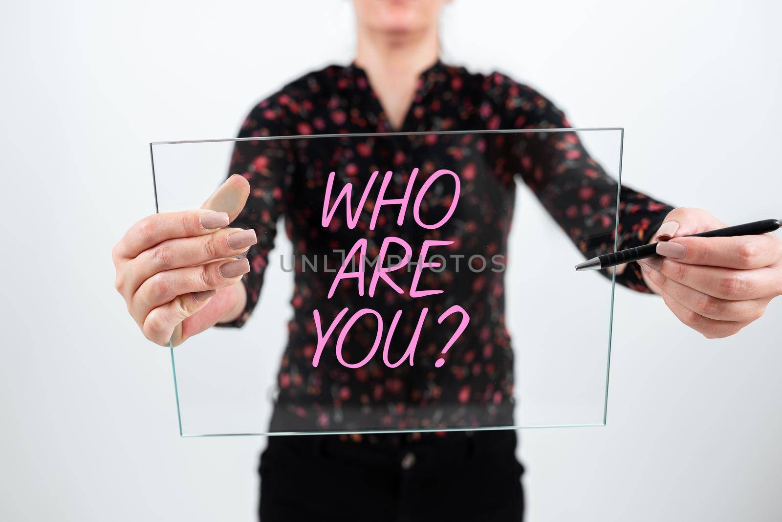 Sign displaying Who Are You Question. Business approach Identify yourself description personal characteristics Man Holding Tablet And Pen Pointing On Search Bar And Presenting New Ideas. by nialowwa