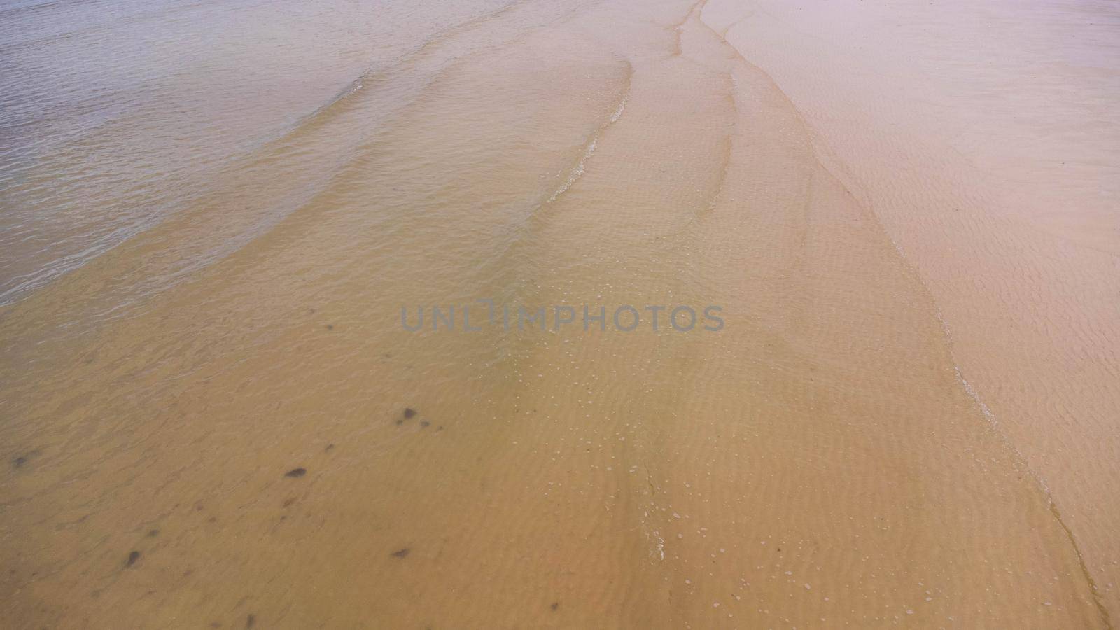 Sandy beach jutting out into the middle of the sea with beautiful water. Laem Haad Beach, Famous attractions of Koh Yao Yai, Phang Nga, Thailand. by TEERASAK