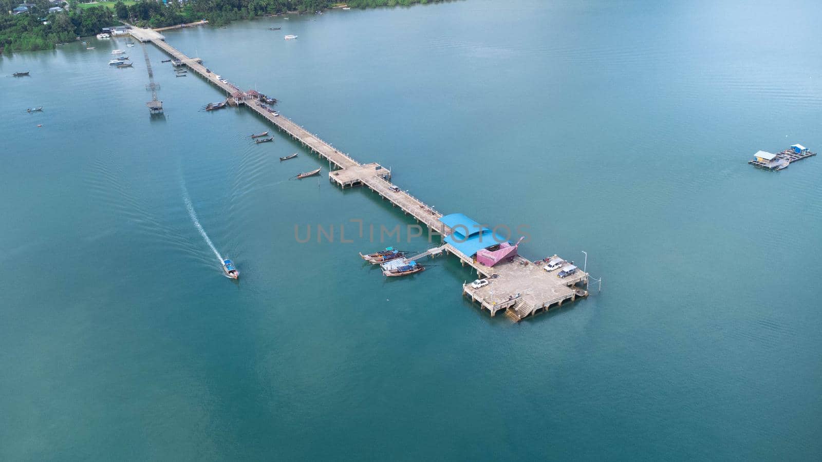 Aerial view from drone of Yacht and cruise ship parked in the marina. Transportation and travel background, beautiful sea in summer. by TEERASAK