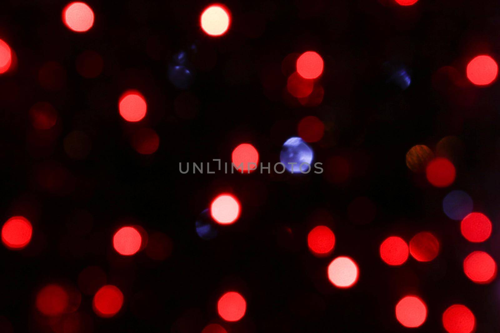 Blurred bokeh of festive garlands at night. by gelog67