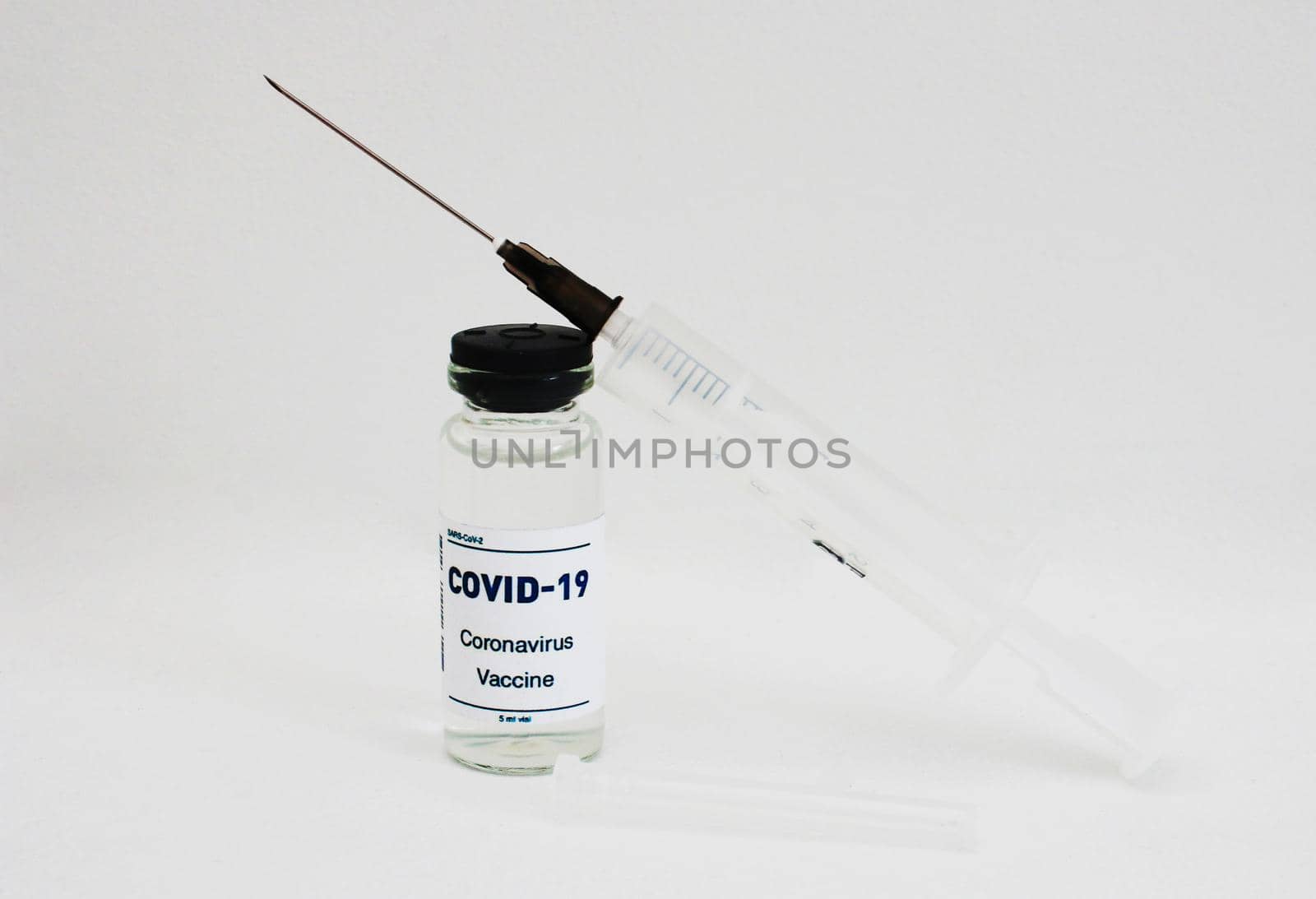 Ampoule with a vaccine. and syringe on white background by gelog67