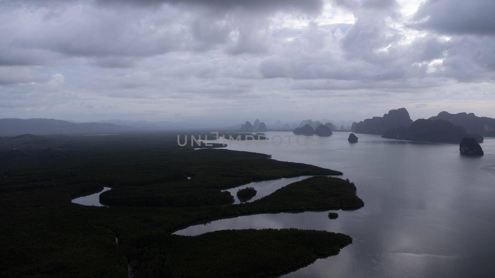 Aerial view of Samet Nangshe and mangrove forest at sunset in Phang Nga Bay in the Andaman Sea, Thailand. Travel and holidays vacation concept. Beautiful natural landscape background