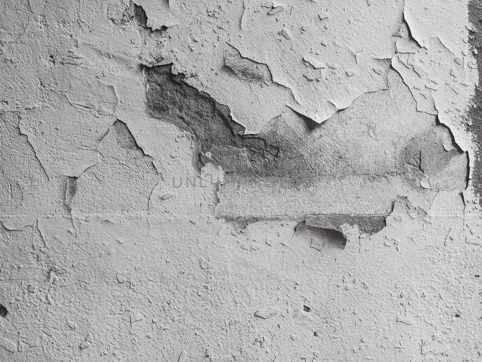 Abstract Background of damaged plaster on concrete wall.