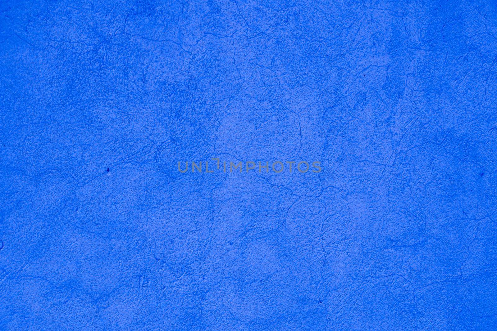 Surface of blue embossed plaster on wall.