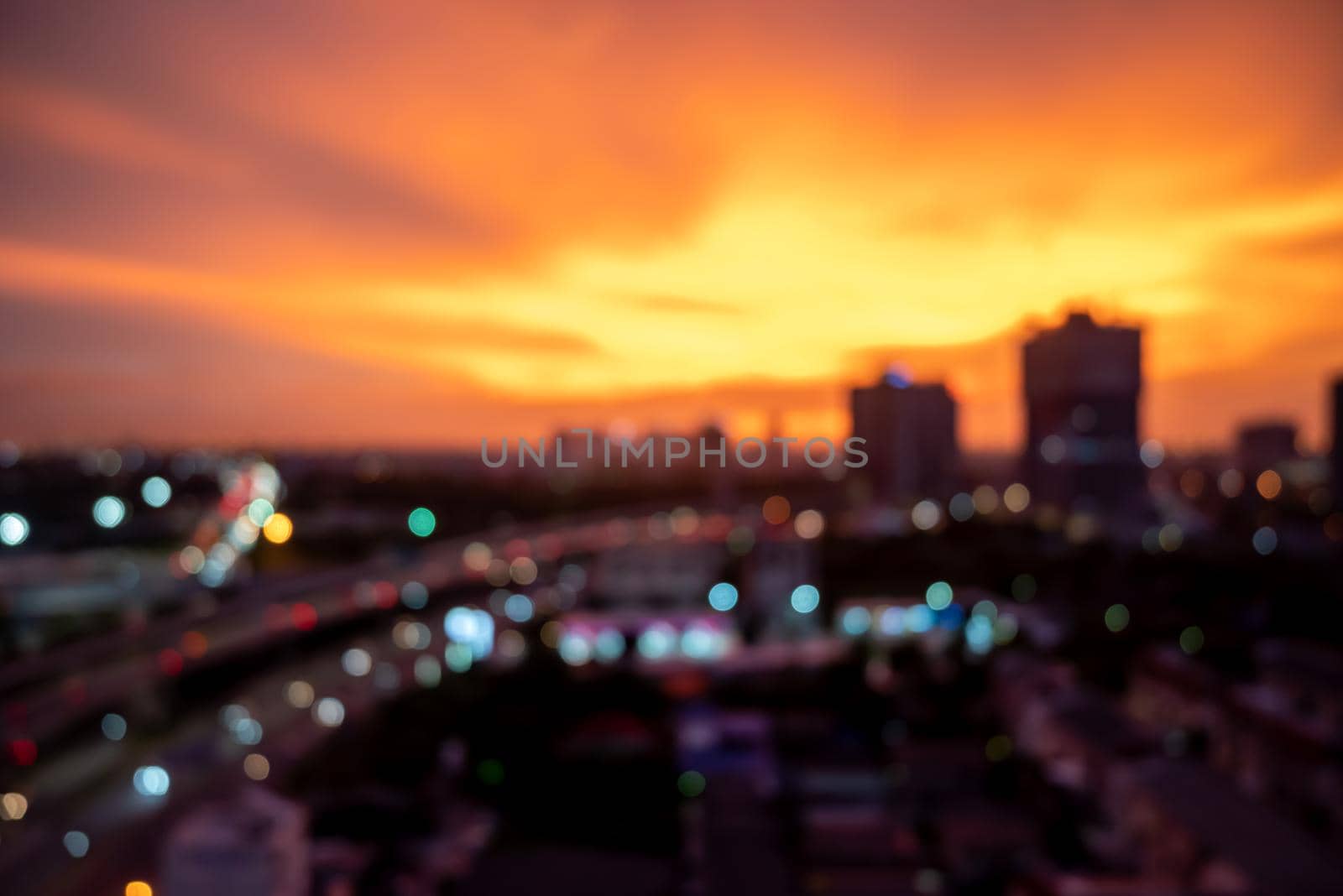 Blur photo background of Bangkok cityscape at twilight time, building skyscraper and creative office in the downtown district.