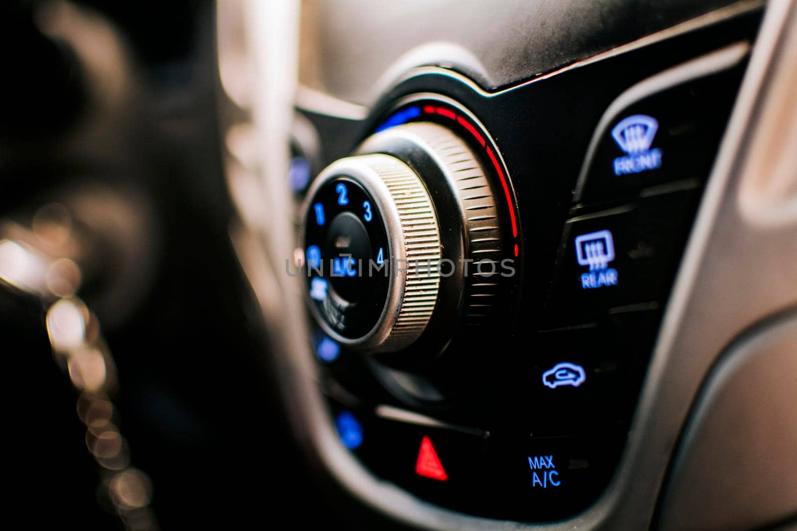 Side view of a car air conditioning control panel. Air conditioning knob of a car. Close up of automotive air conditioning switch panel