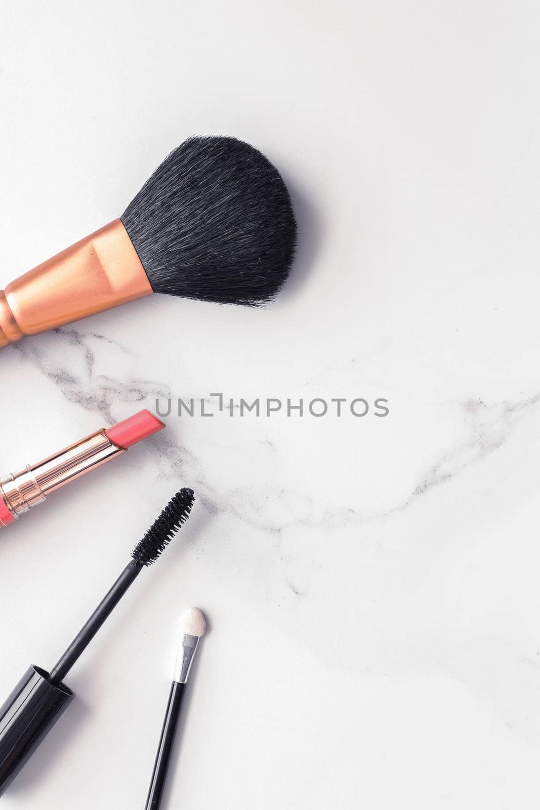 Make-up and cosmetics flatlay on marble by Anneleven