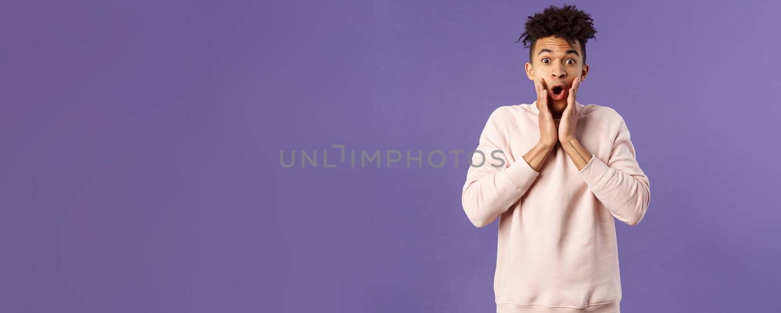 Oh my gosh. Portrait of amazed, speechless excited hispanic guy staring overwhelmed at something stunning, watching incredible performance, react shocked and amazed, purple background by Benzoix