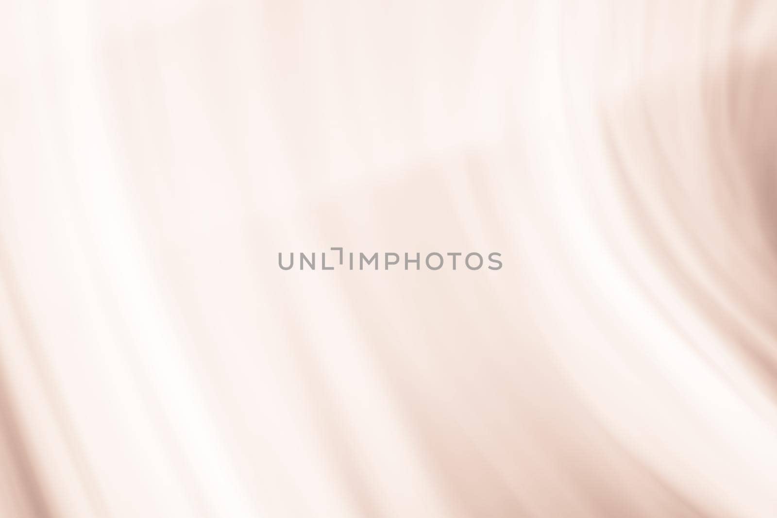 Soft beige radiation in waves with blur and gradient. Abstraction. The background