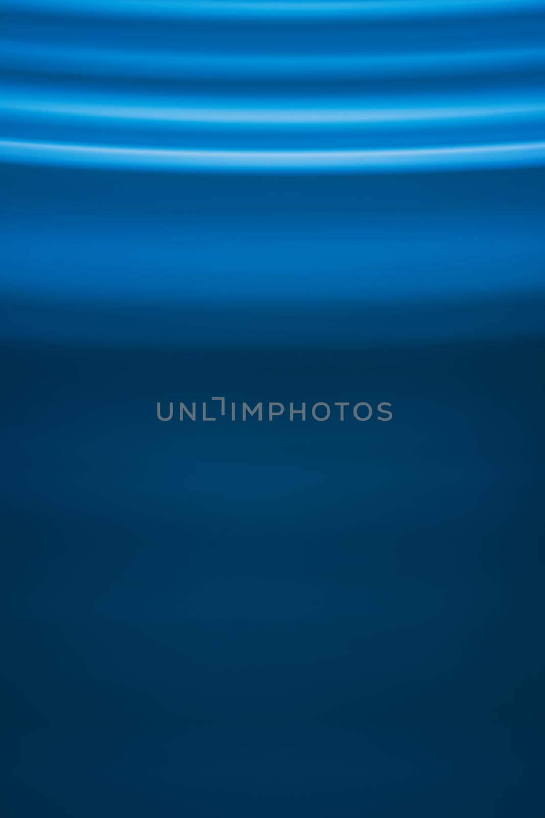 Abstract vertical background in blue tones with waves on top of the picture. Backdrop