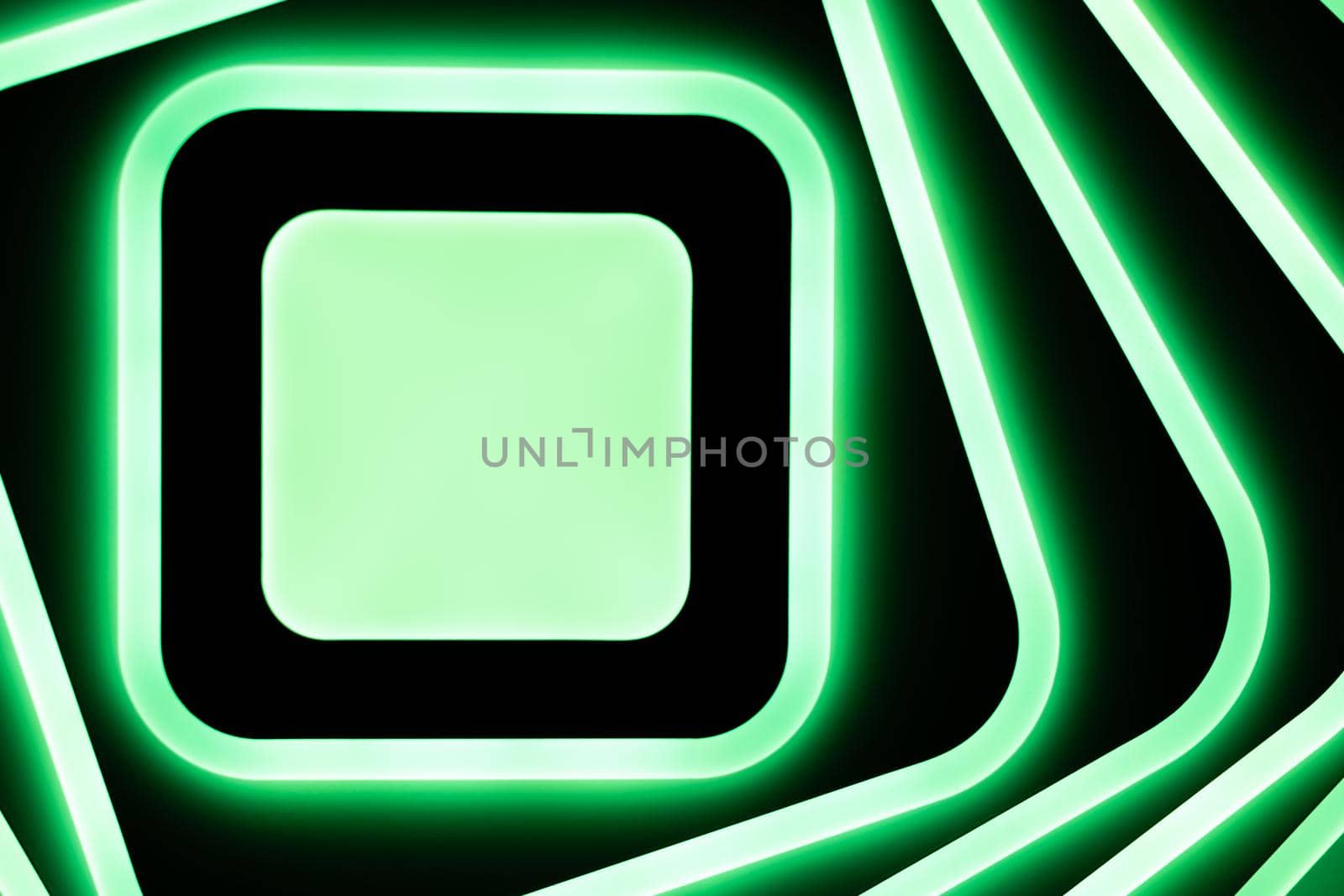 Abstract square green white LED lamp shining brightly on a dark ceiling. Banner for Advertising. Backdrop