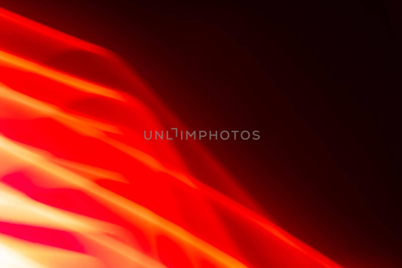 Abstract glowing red waves on a dark background. Banner. Backdrop