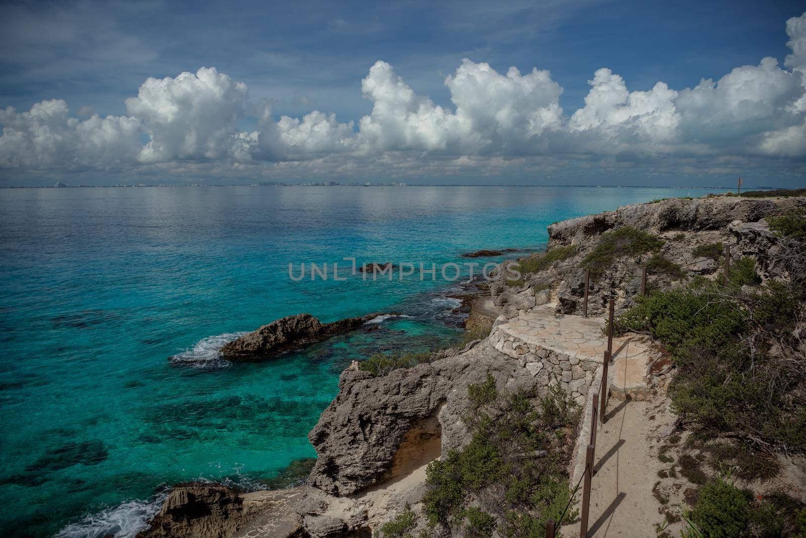 Rocky Caribbean Sea coastline with rocks and azure water on the Isle of Women