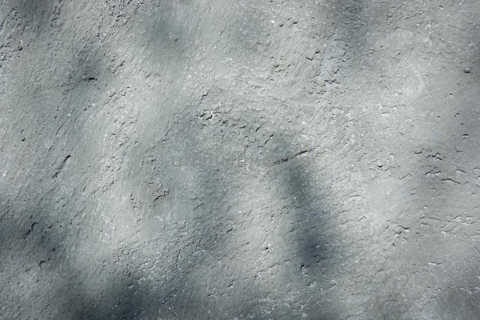 Leaf shadows on gray concrete. The theme of repair and construction. Backdrop