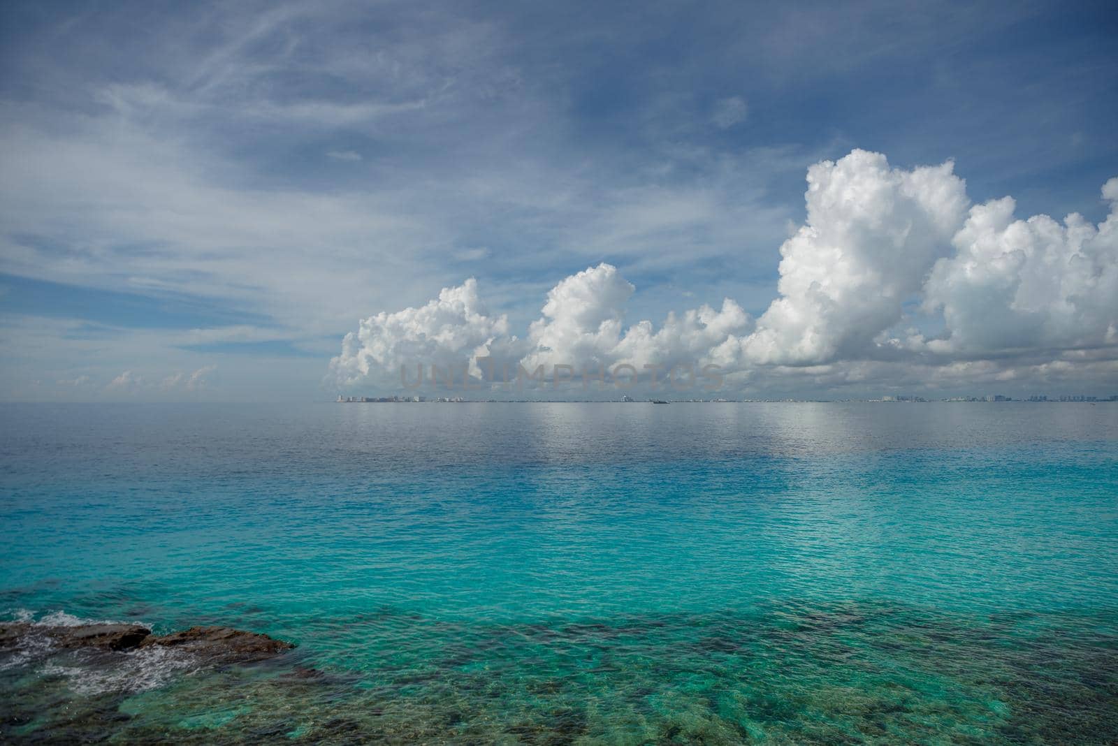 Rocky Caribbean Sea coastline with rocks and azure water on the Isle of Women