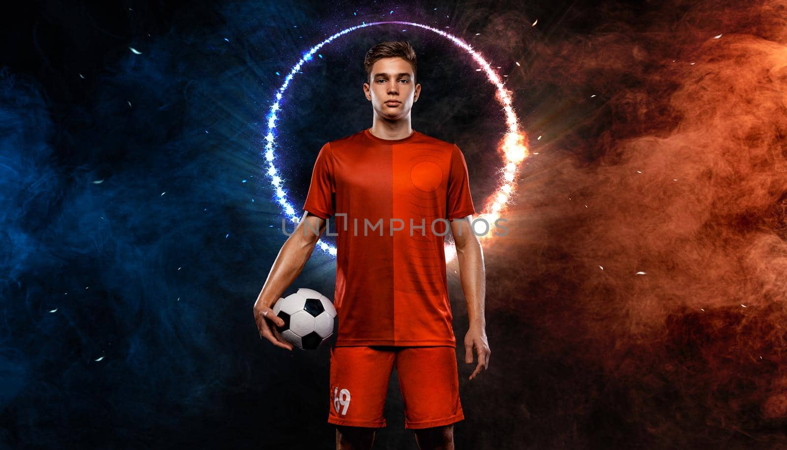 Soccer player. Athlete in football sportswear on game with ball. Sport concept