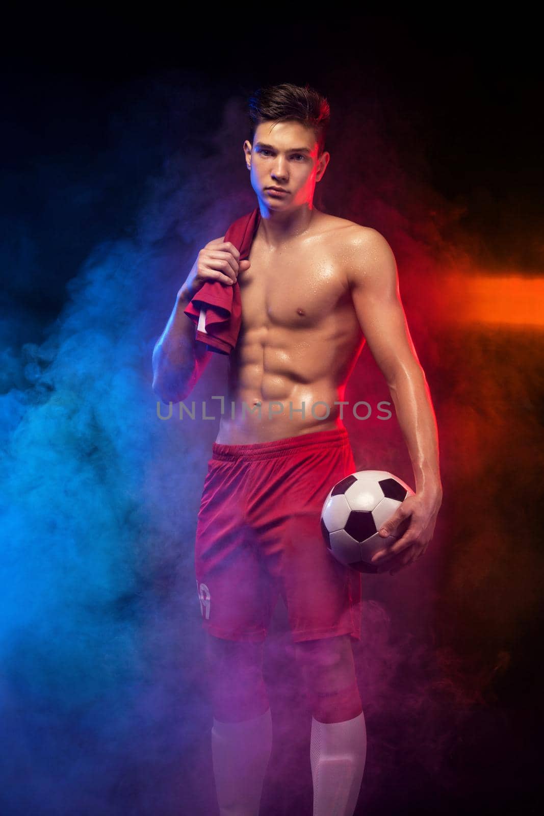 Teenager - soccer player. Boy in football sportswear after game with ball. Sport concept. by MikeOrlov