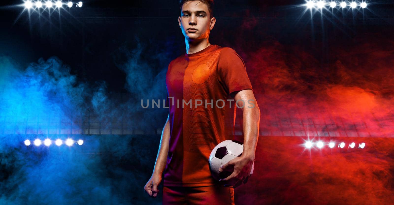 Teenager - soccer player. Man in football sportswear after game with ball. Sport concept. by MikeOrlov