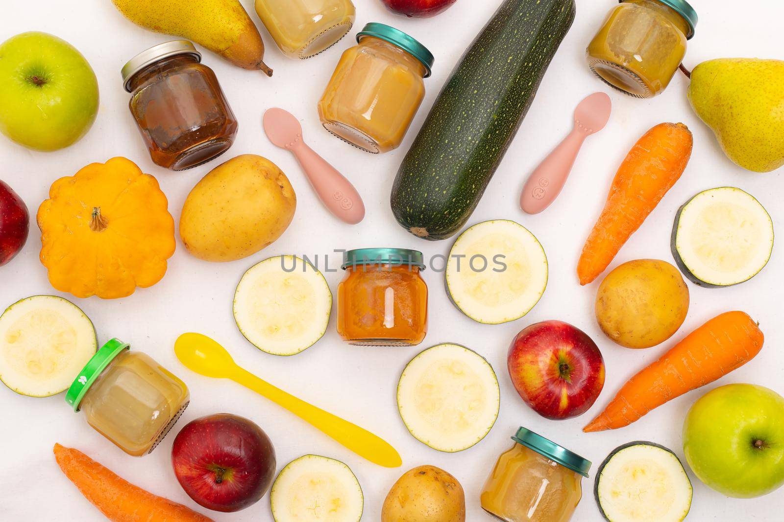 Layout of Puree for baby food with vegetables and fruits. Selective focus. nutrition. The first complementary feeding of the child. A happy child. A well-fed child. Copy space. Article about baby food
