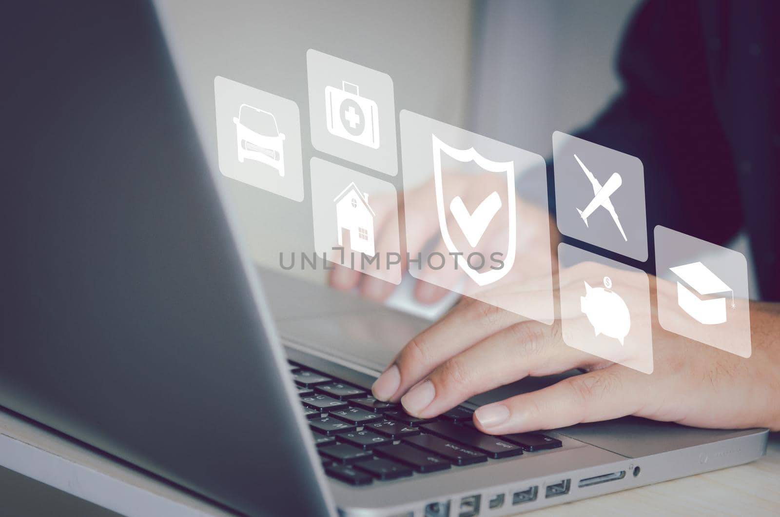 Man hand using a computer to type on a keyboard to find information on the Internet on social networks.Insurance health care investment finance and home estate icon virtual business concept.