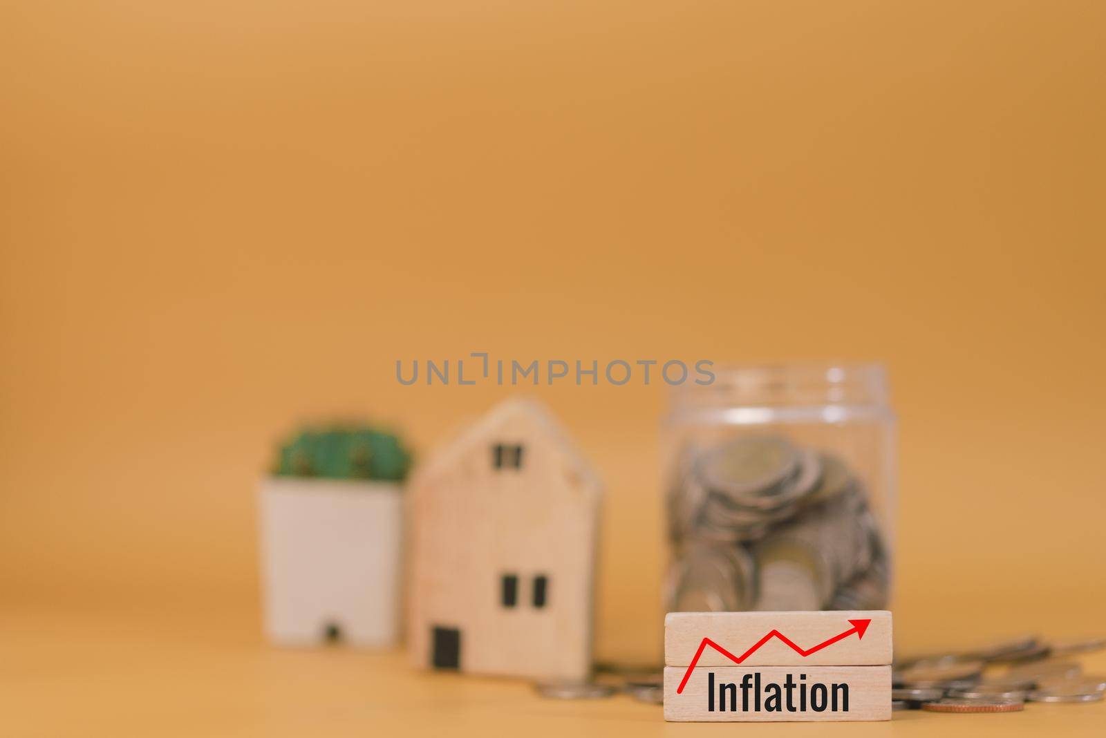 Saving money finance inflation investment economy and insurance home cash budget business concept yellow background.