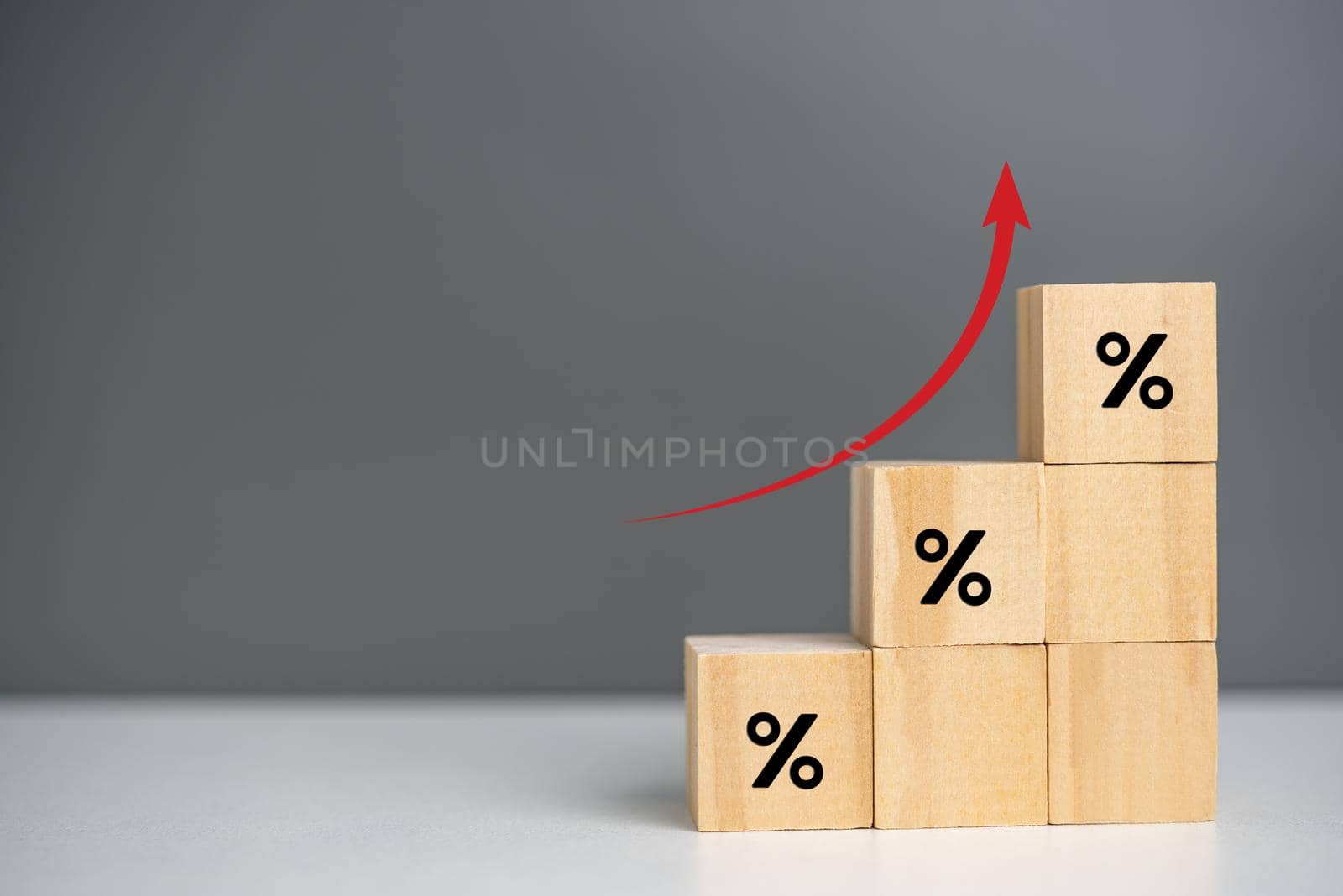 Wooden cubes inflation and arrow red with wood cube percentage symbol on background and copy space.Business finance concepts. by aoo3771