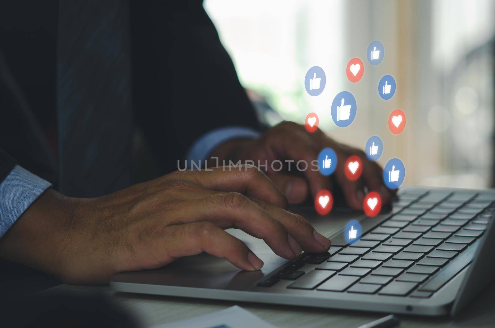 Social media business concept and marketing online technology digital network internet icon like and love connection on computer laptop with businessman.