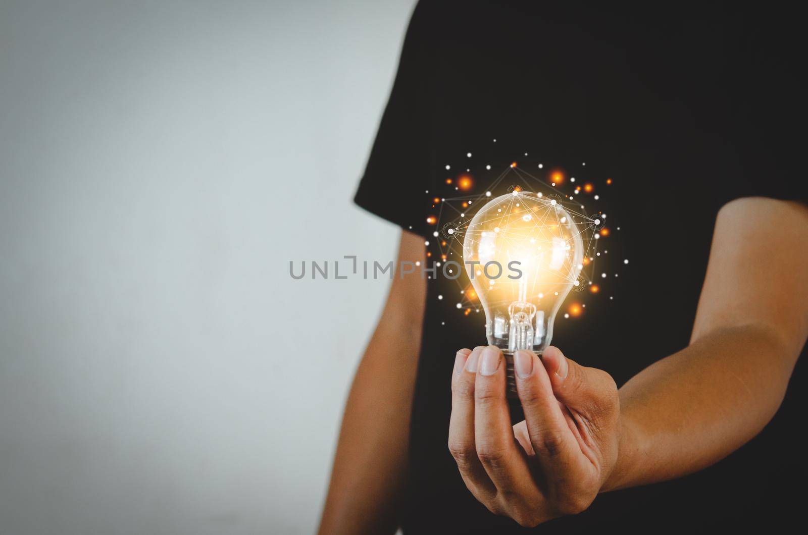 Man holding light bulbs ideas innovation technology and creative business concept. by aoo3771