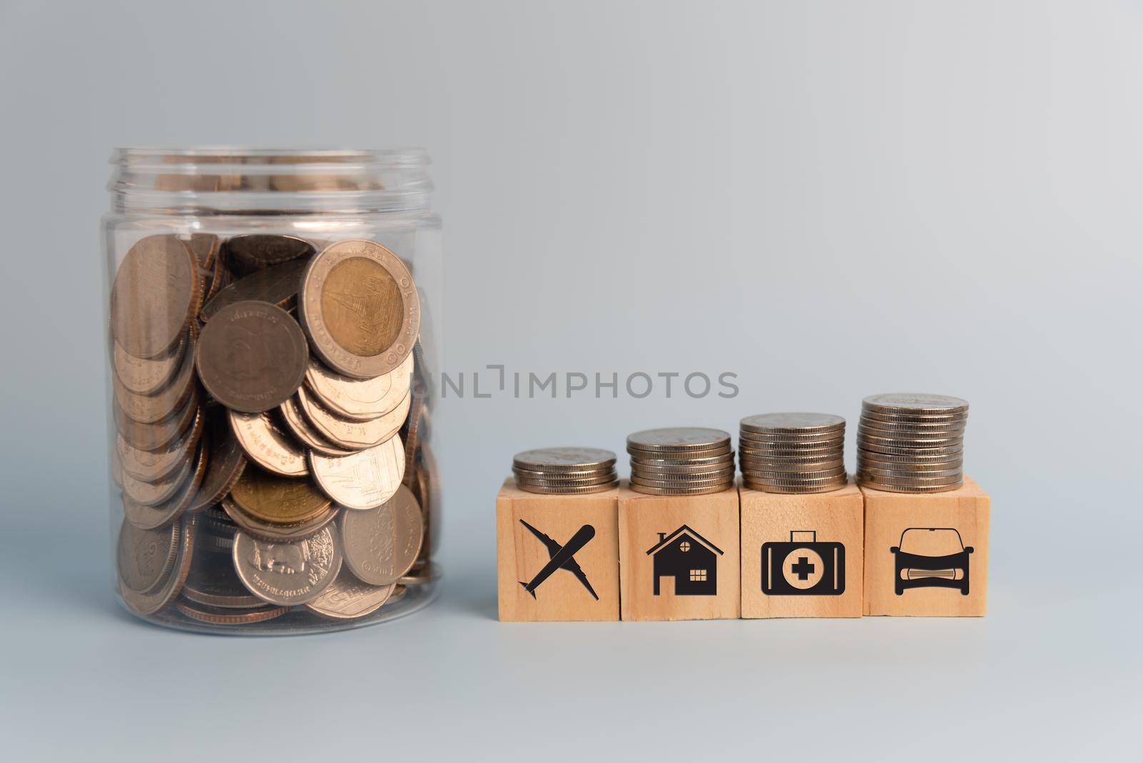 coin and wood cube block icon insurance assessment on table.Business finance investment saving money economy growth success concept. by aoo3771