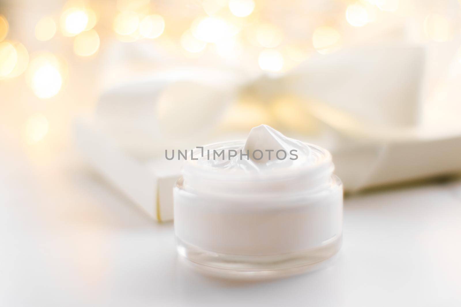 Beauty, anti-age cosmetics and skincare concept - Luxury face cream jar and holiday glitter