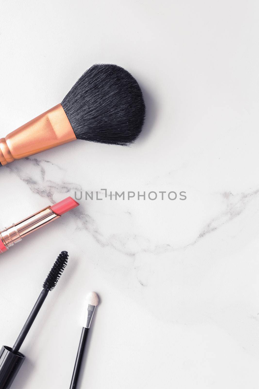 Make-up and cosmetics flatlay on marble by Anneleven