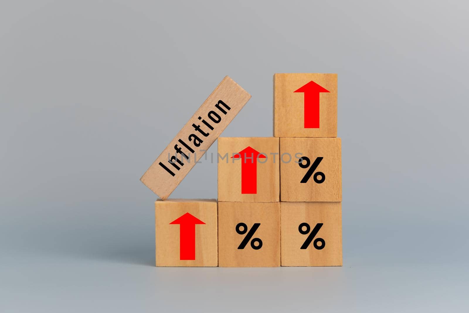 Wooden cubes inflation and arrow red with wood cube percentage symbol on background and copy space.Business finance concepts. by aoo3771