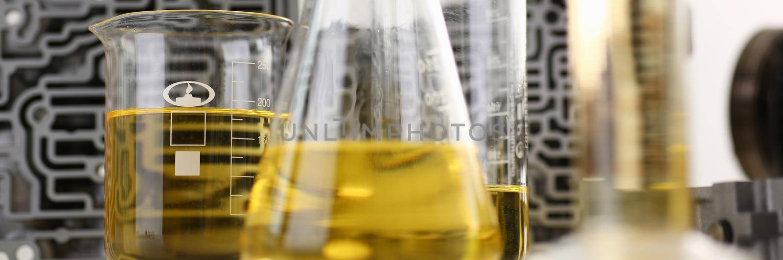 Test tube chemistry flask against of hydroblock acp with yellow liquid by kuprevich