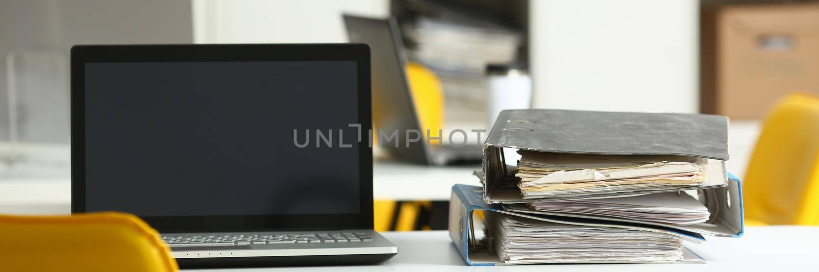 Empty workplace folders with documents in office on table closeup. Planning work day concept