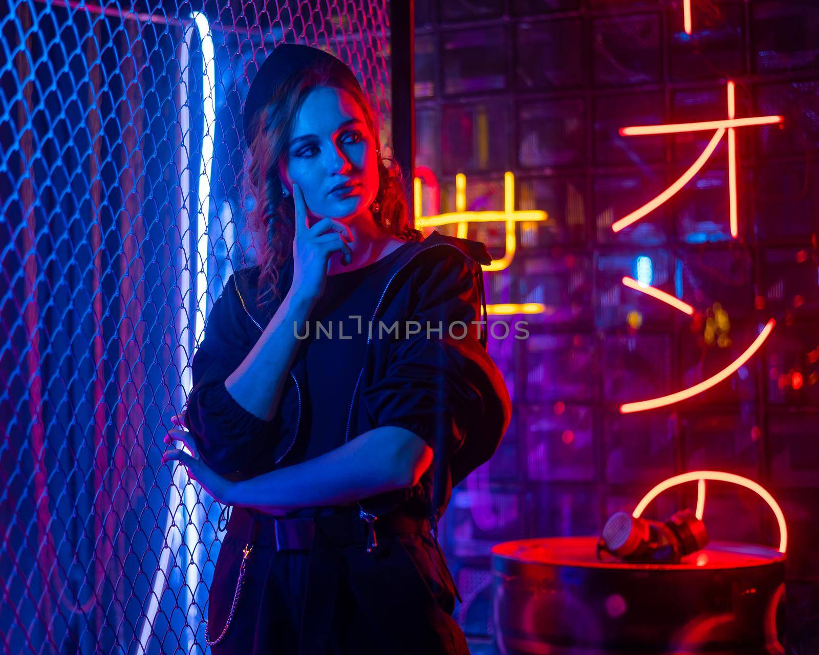 Caucasian woman posing in neon studio