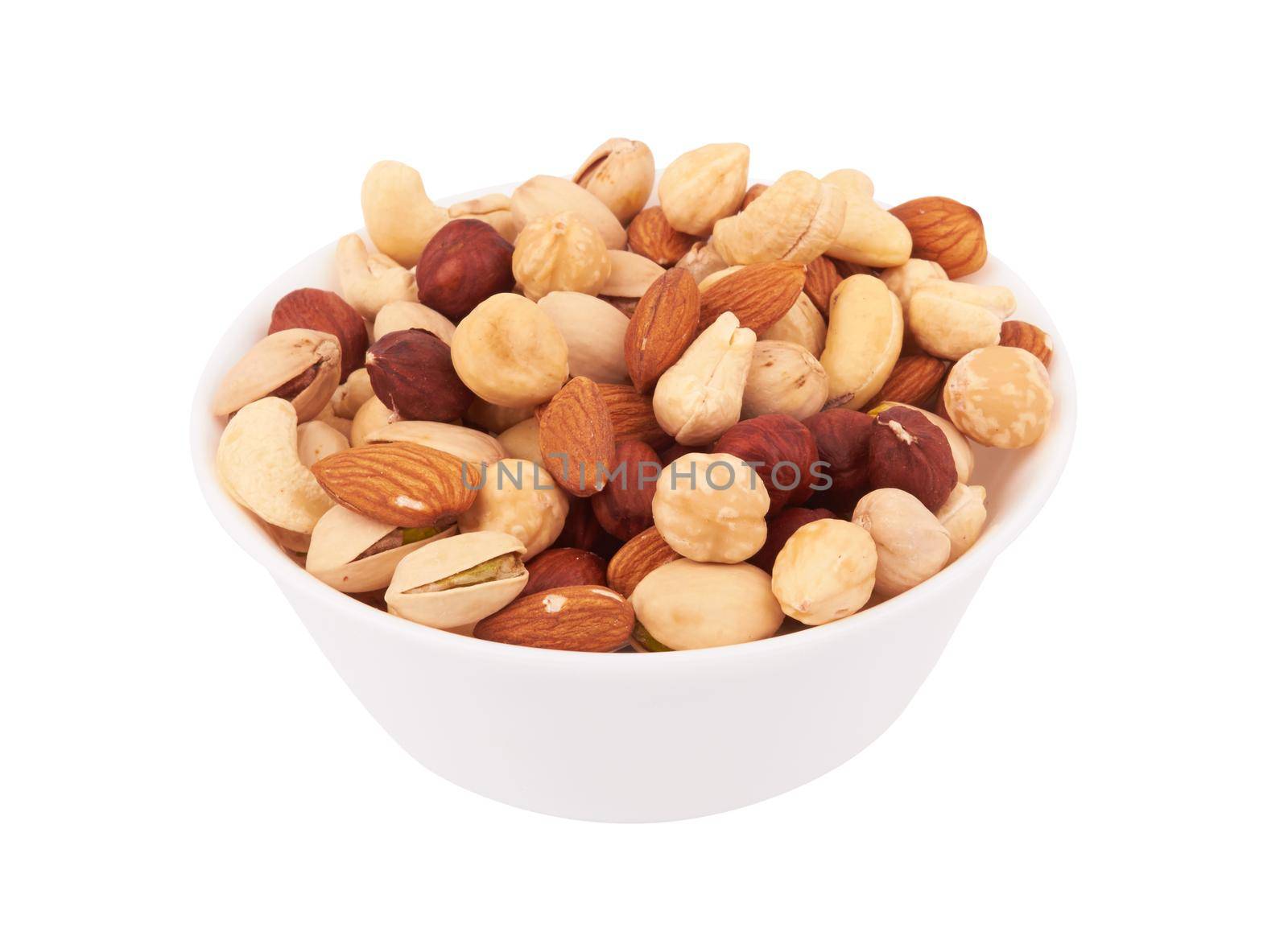 Heap of mixed nuts in bowl isolated on white background
