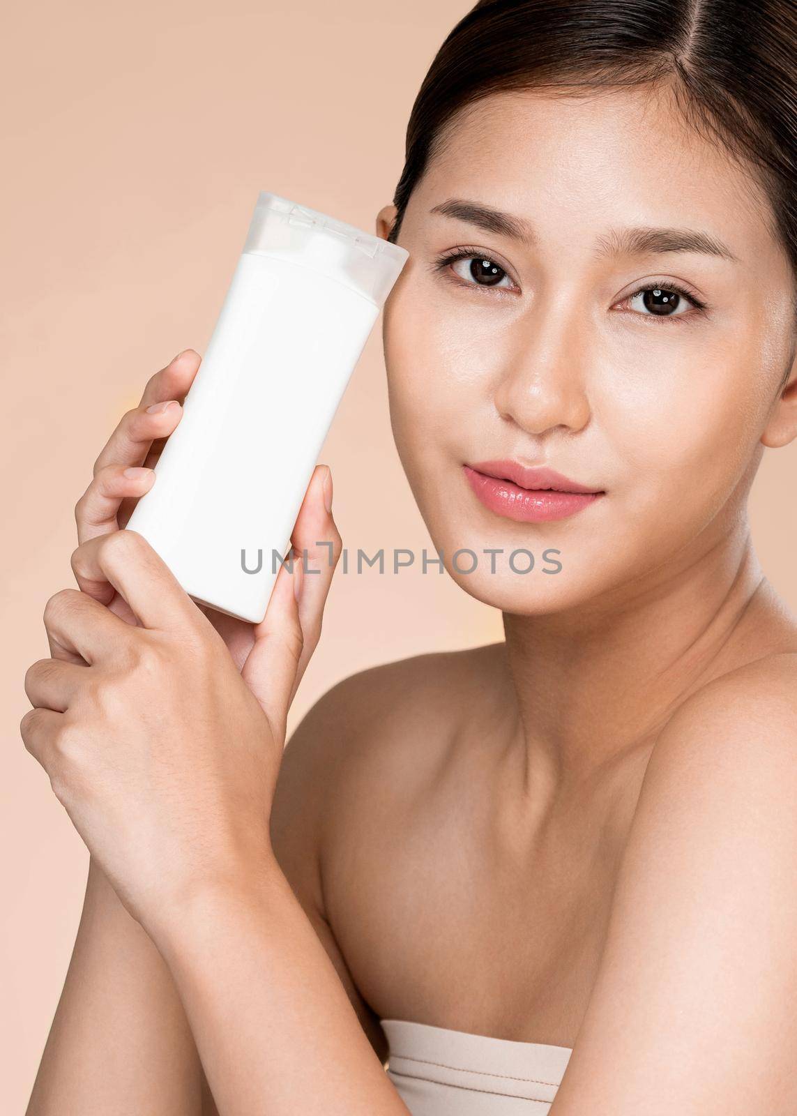 Closeup ardent woman smiling holding mockup product for advertising text place. by biancoblue