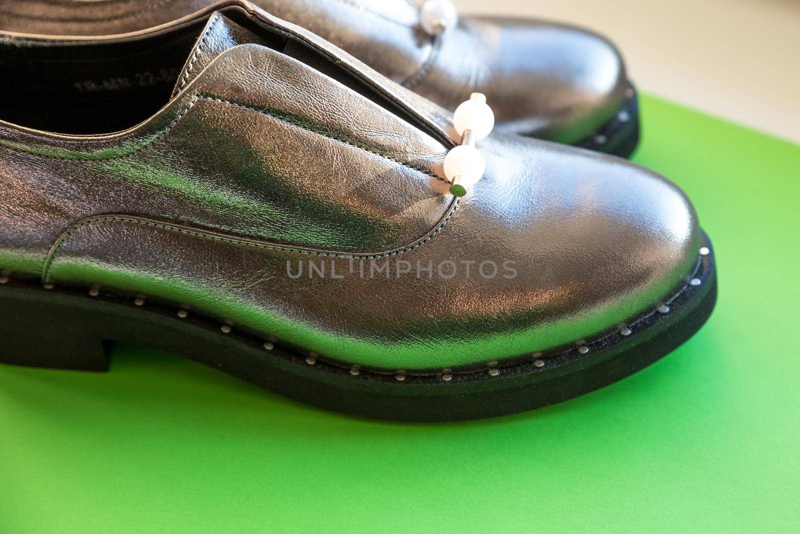 Studio shot of stylish brown autumn boots, isolated on white background
