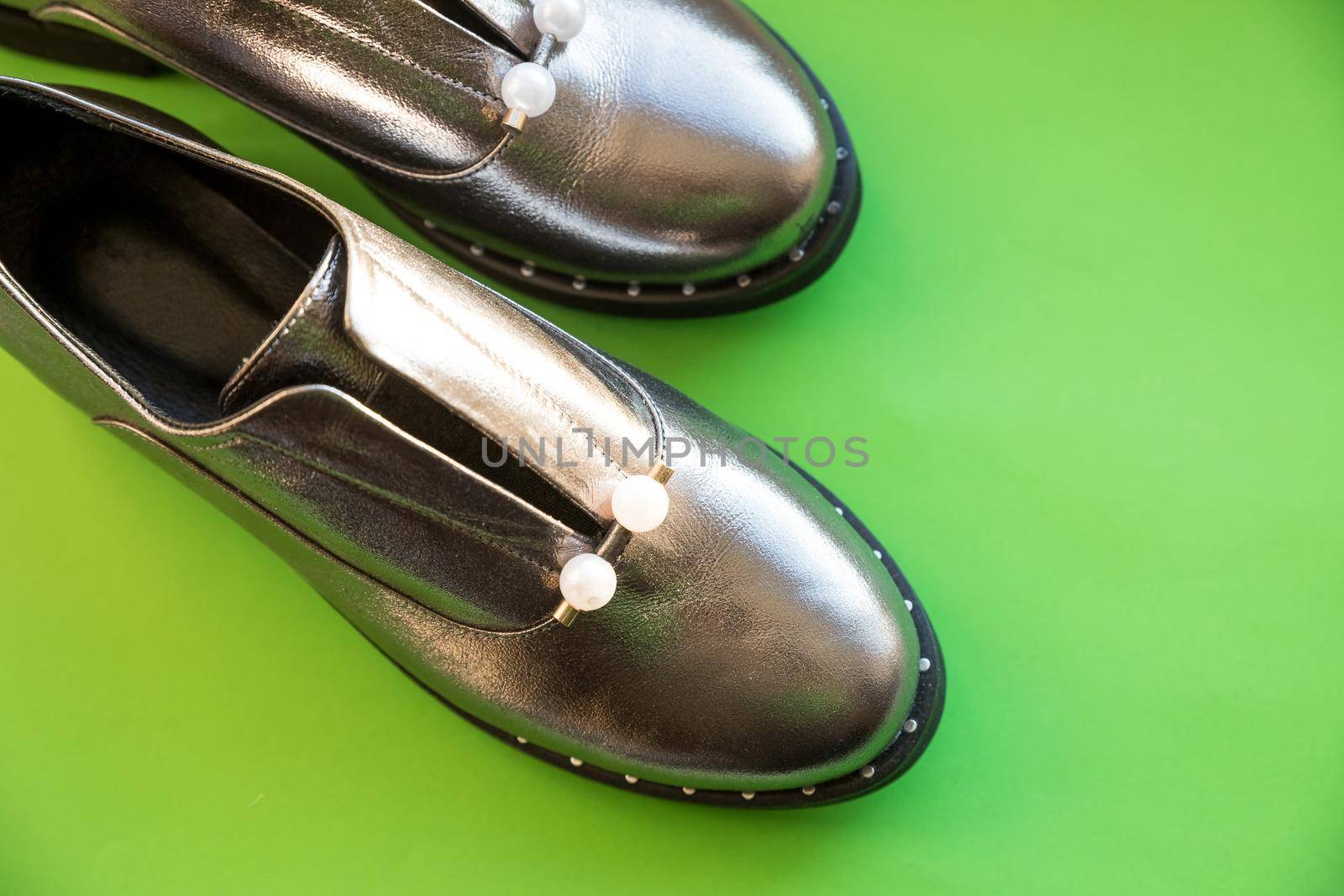 Studio shot of stylish brown autumn boots, isolated on white background