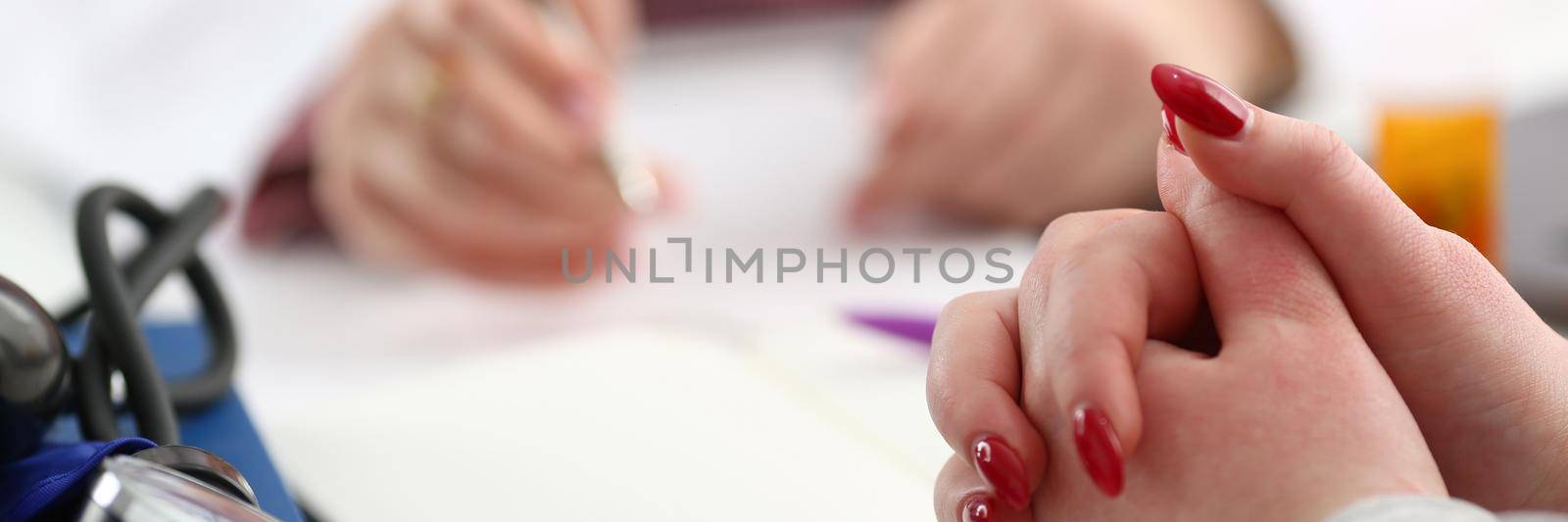 Hands of woman patient for medical report written by doctor about health condition. Medical service concept