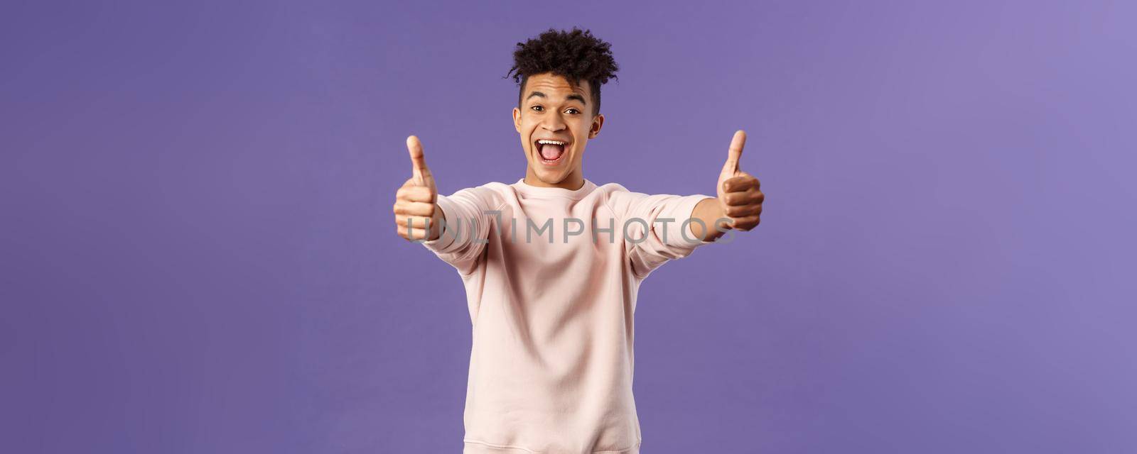 Portrait of satisfied young happy man think event was super cool, recommend use company service, assure in best quality, like and approve awesome product, standing purple background by Benzoix