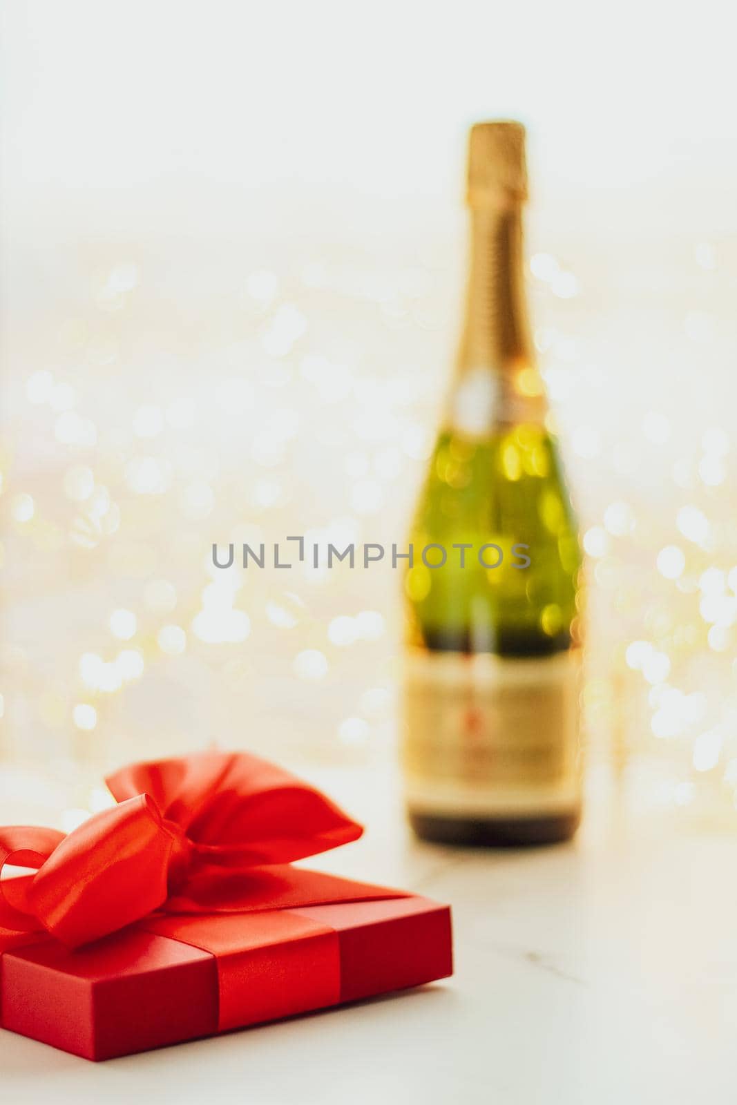 The bottle of champagne and holiday gift box by Anneleven