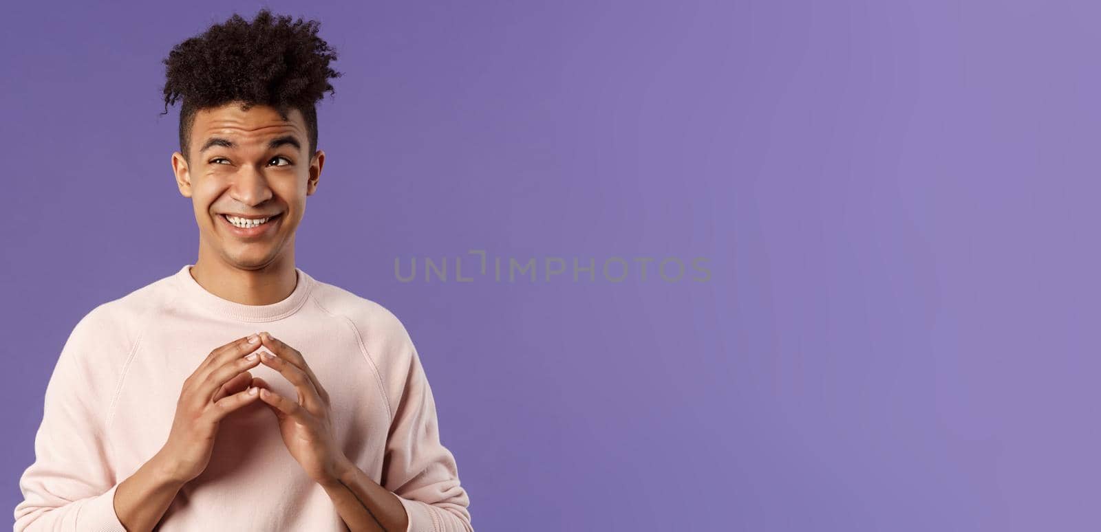 Close-up portrait of creative young hispanic guy steeple fingers while making-up great plan or joke, look away daydreaming, scheming something, have idea, stand purple background.