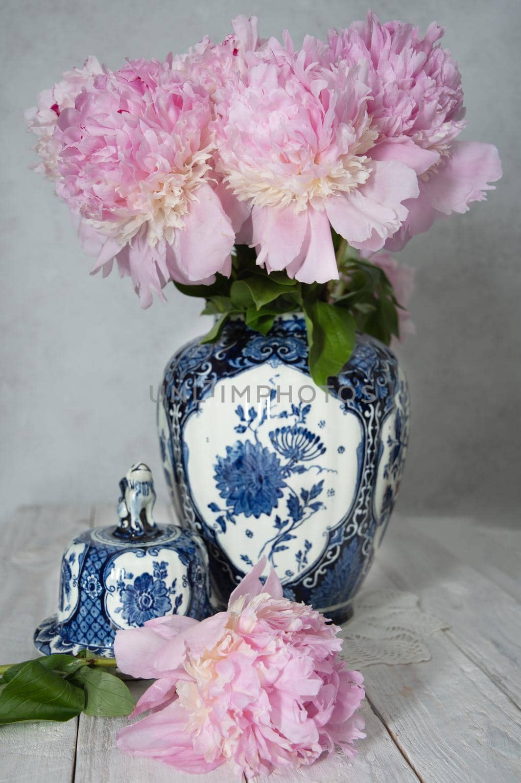 pink luxurious peonies in an ancient Chinese vase with blue ornament, springtime by KaterinaDalemans