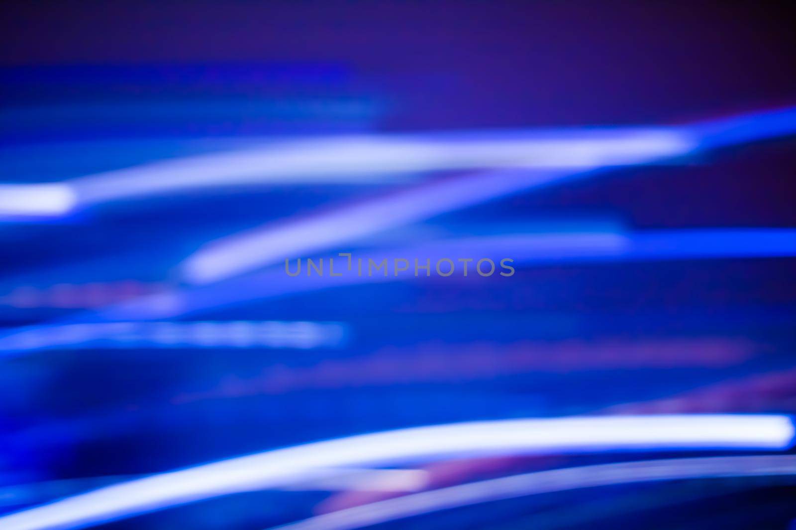 Technology, defocused textures and futuristic design concept - Neon lights background, abstract lines in motion